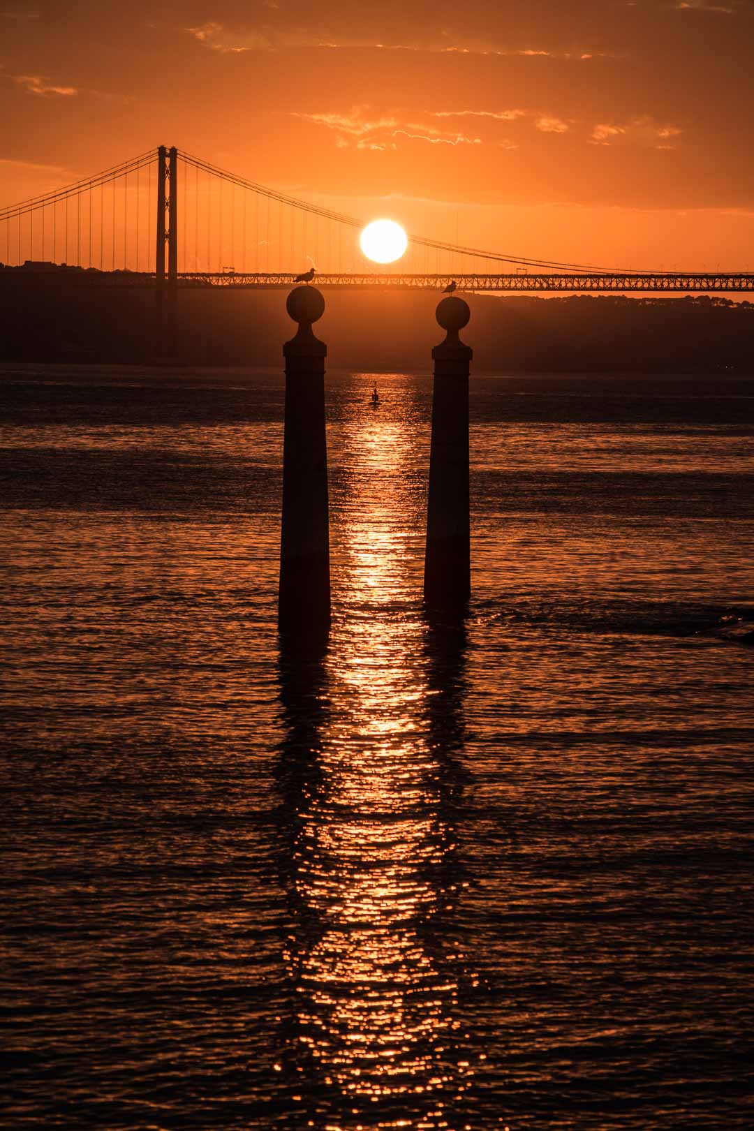 Solnedgång över Tejo i Lissabon